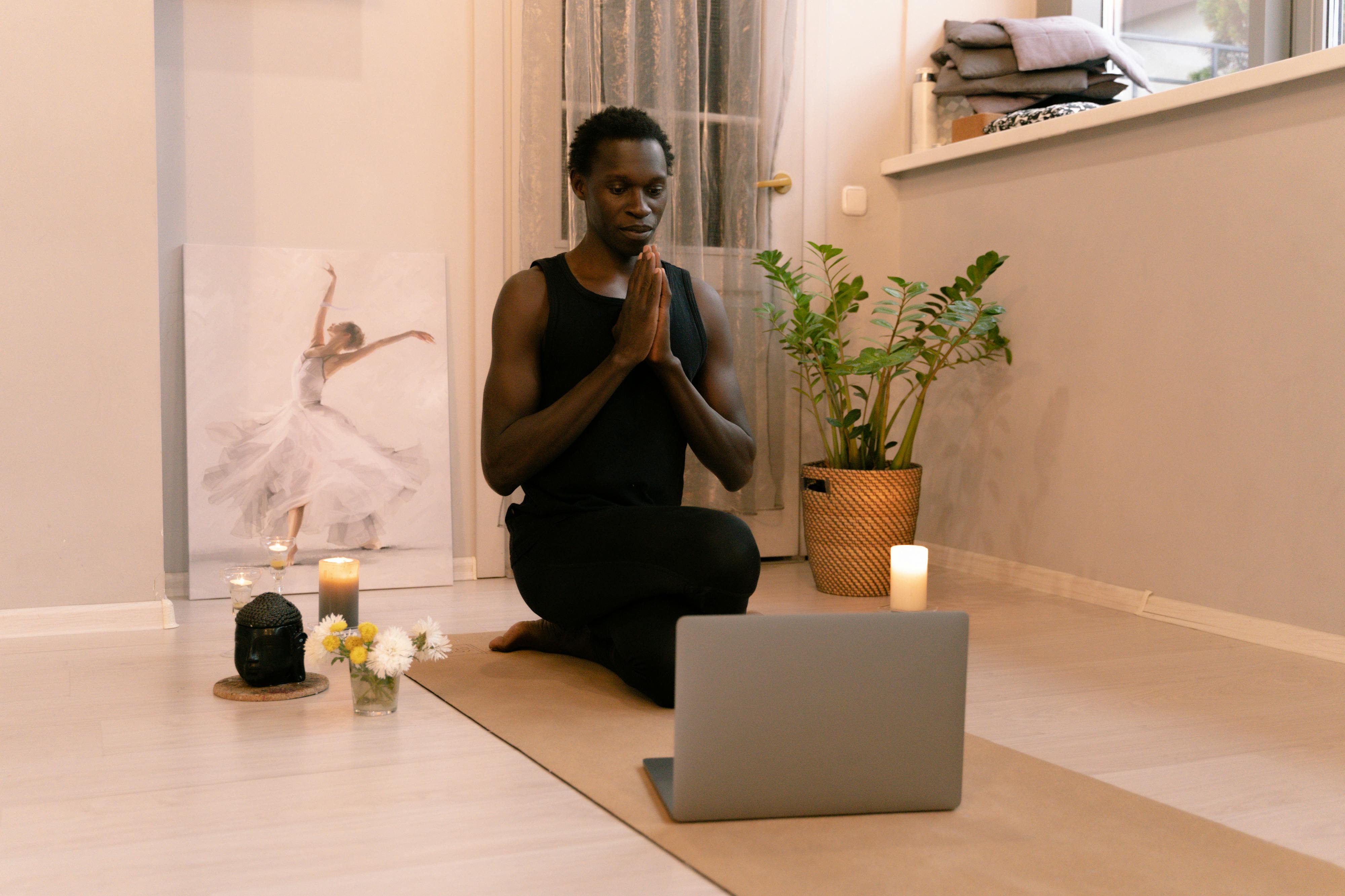 image of a man doing yoga practcing self care with sheniqua scented candles in windsor ontario